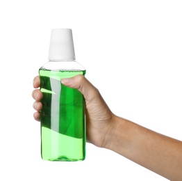 Photo of Woman holding bottle with mouthwash for teeth care on white background