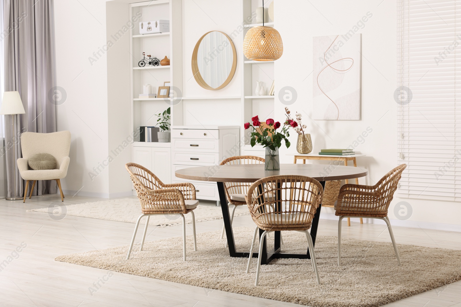 Photo of Stylish dining room interior with comfortable furniture