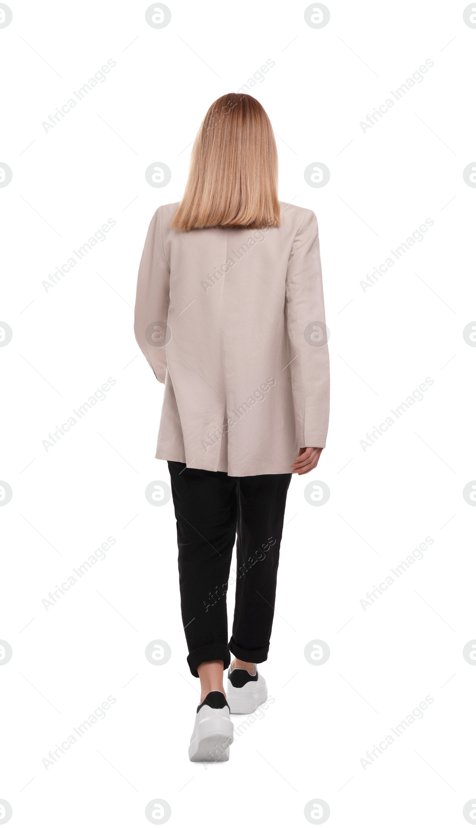 Photo of Businesswoman walking on white background, back view