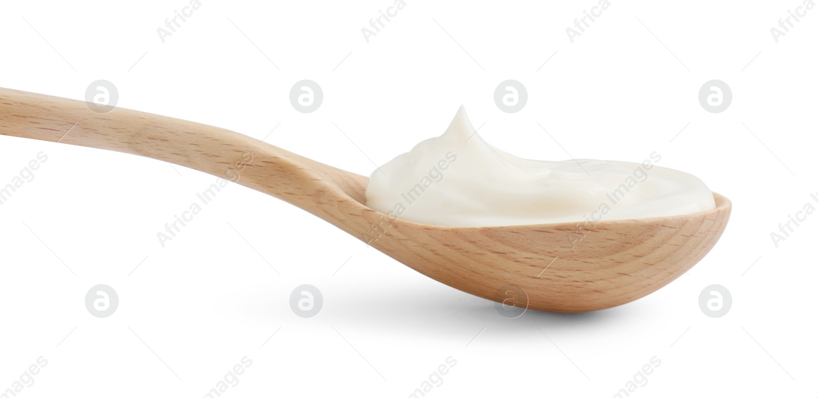 Photo of One wooden spoon with mayonnaise isolated on white