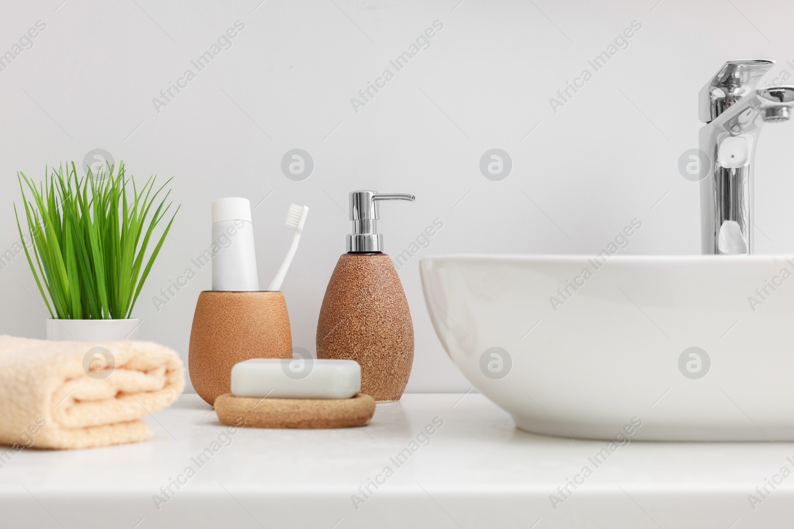 Photo of Set of different bath accessories and products on white table