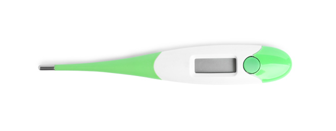 Modern digital thermometer on white background, top view