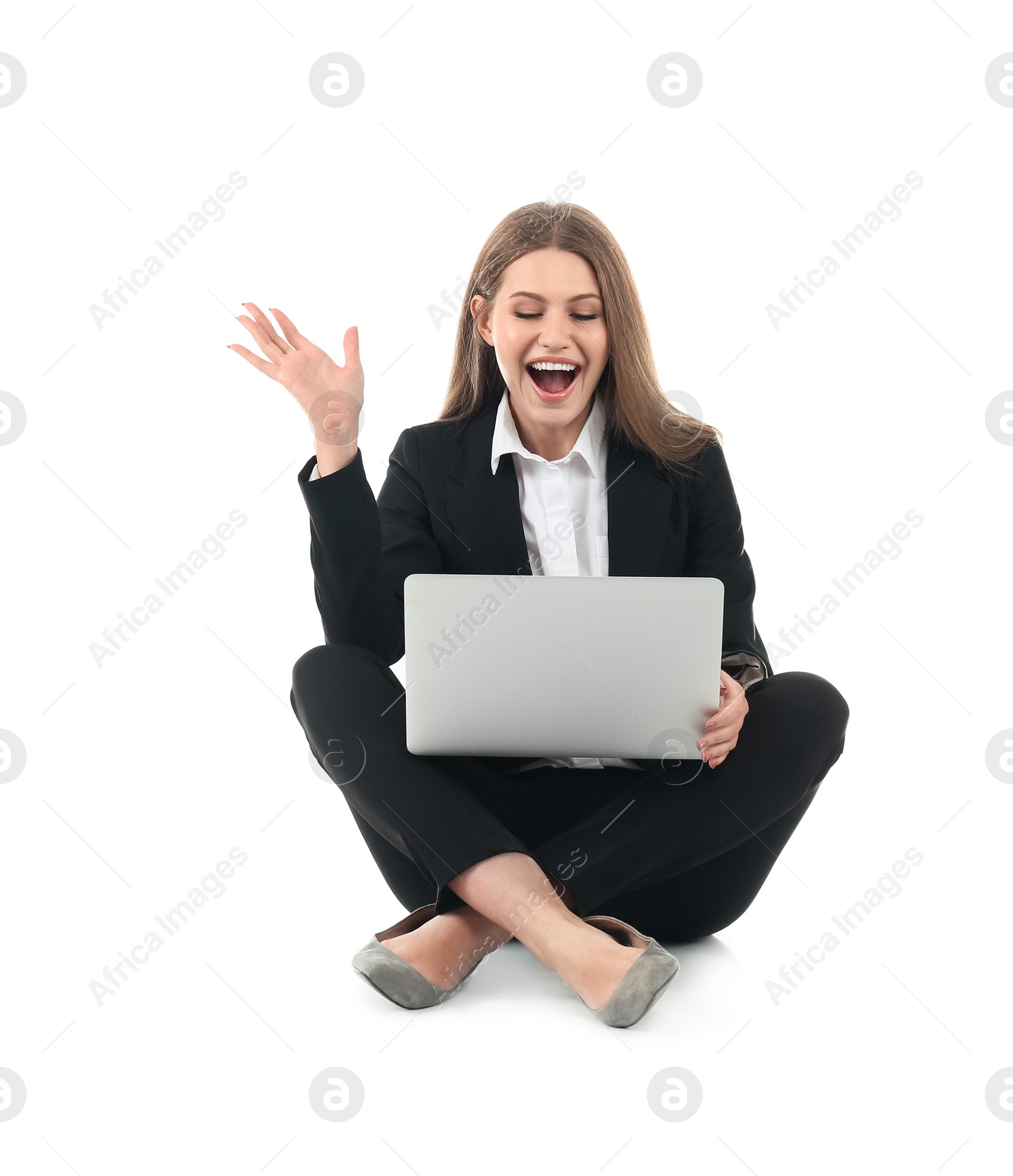 Photo of Emotional businesswoman in office wear with laptop celebrating victory on white background