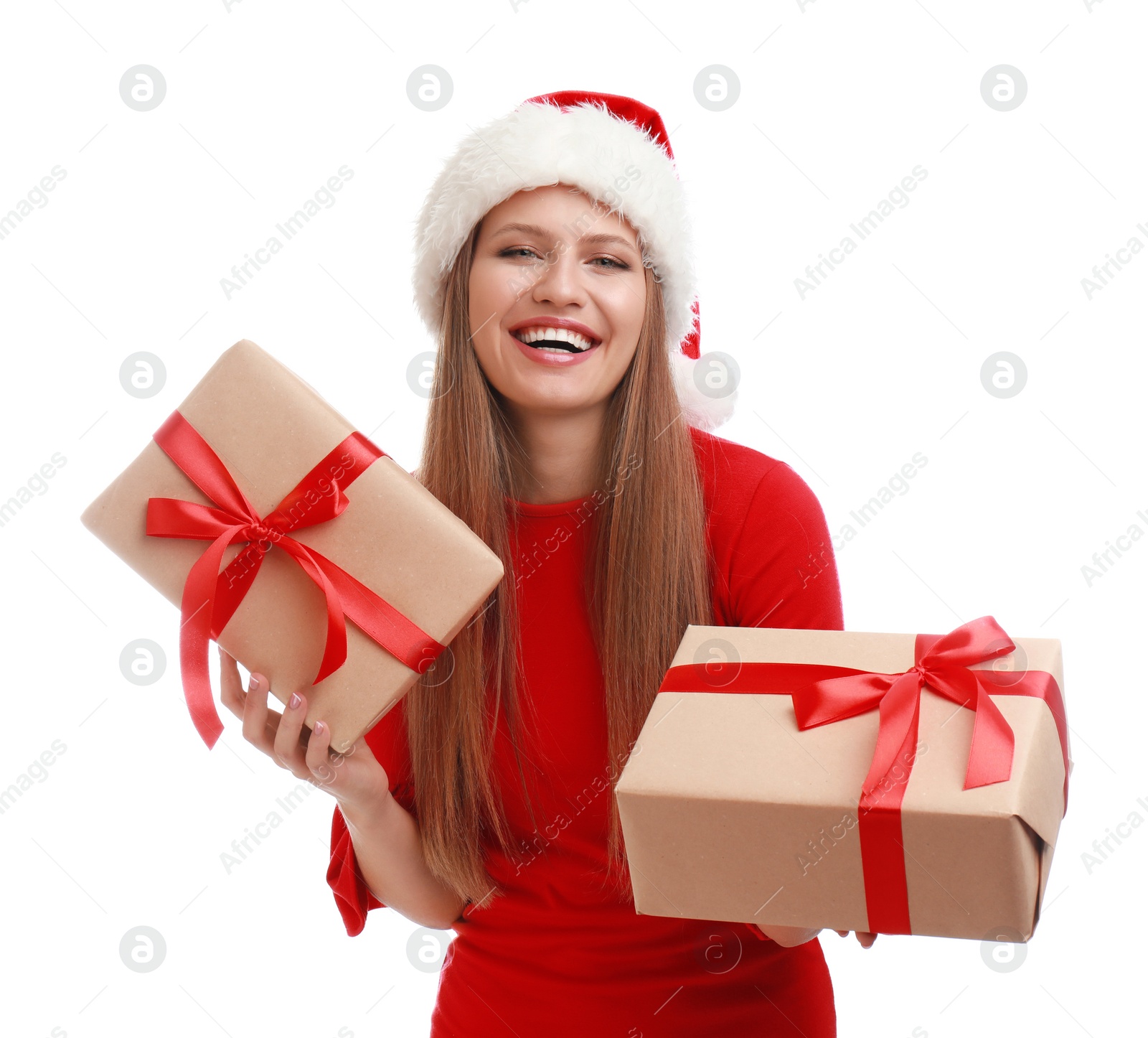 Photo of Happy young woman in Santa hat with Christmas gifts on white background