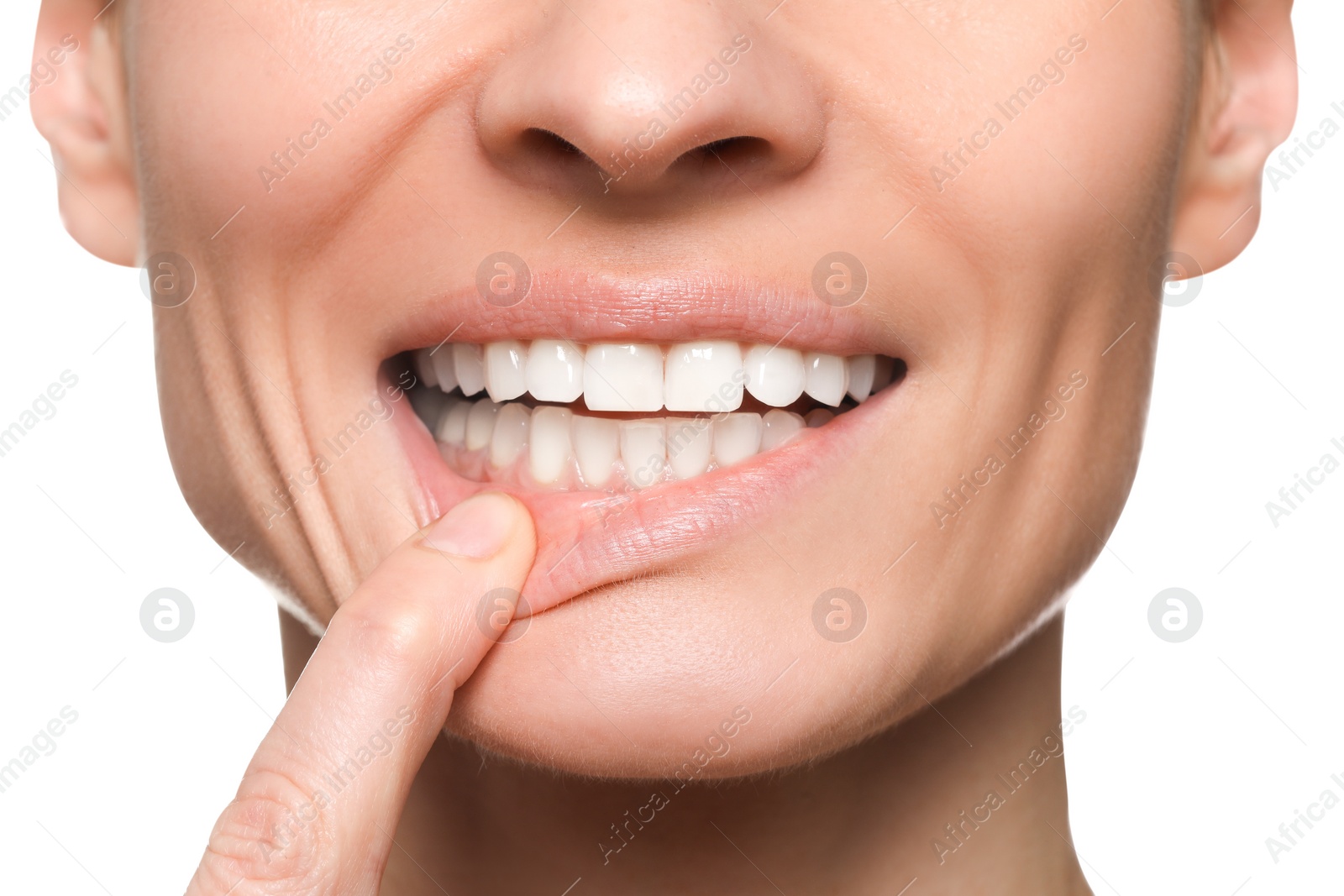 Photo of Woman showing healthy gums on white background, closeup