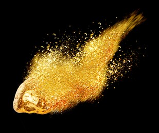 Image of Gold nugget and shiny glitter as comet on black background