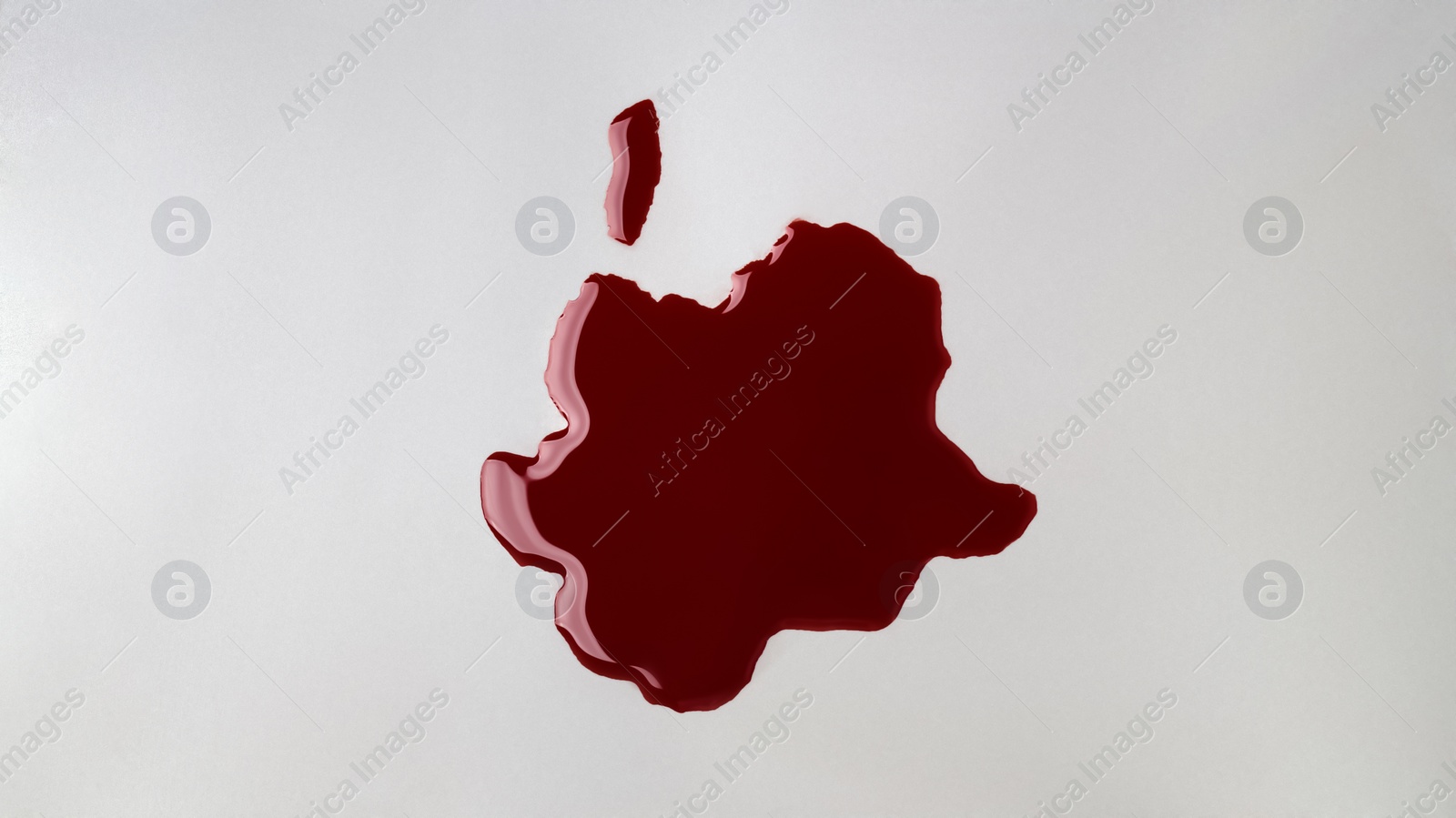 Photo of Stain of blood on grey background, top view