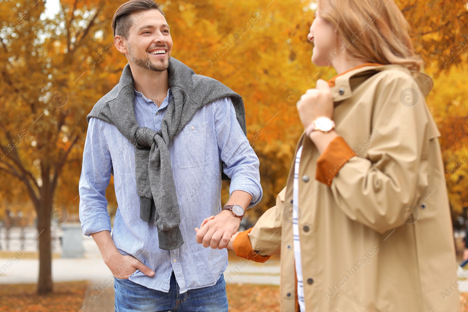 Photo of Lovely couple spending time together in park. Autumn walk