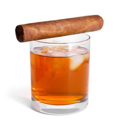 Photo of Glass of whiskey and cigar isolated on white