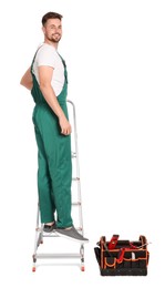 Worker in uniform on metal ladder against white background