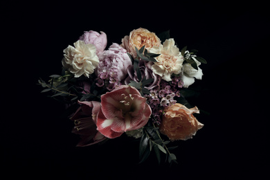 Photo of Beautiful bouquet of different flowers on black background. Floral card design with dark vintage effect