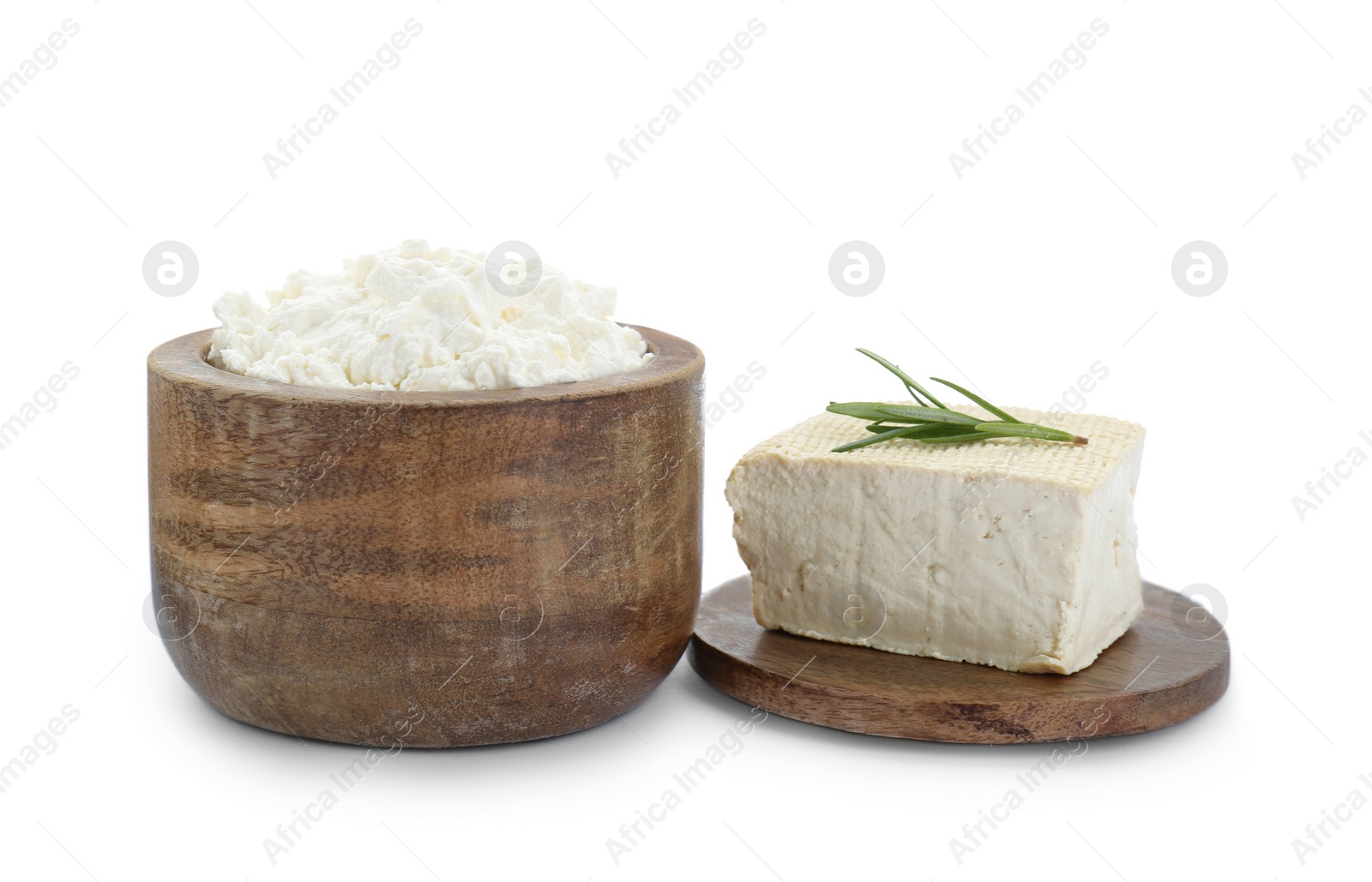 Photo of Different types of delicious tofu cheese with rosemary on white background