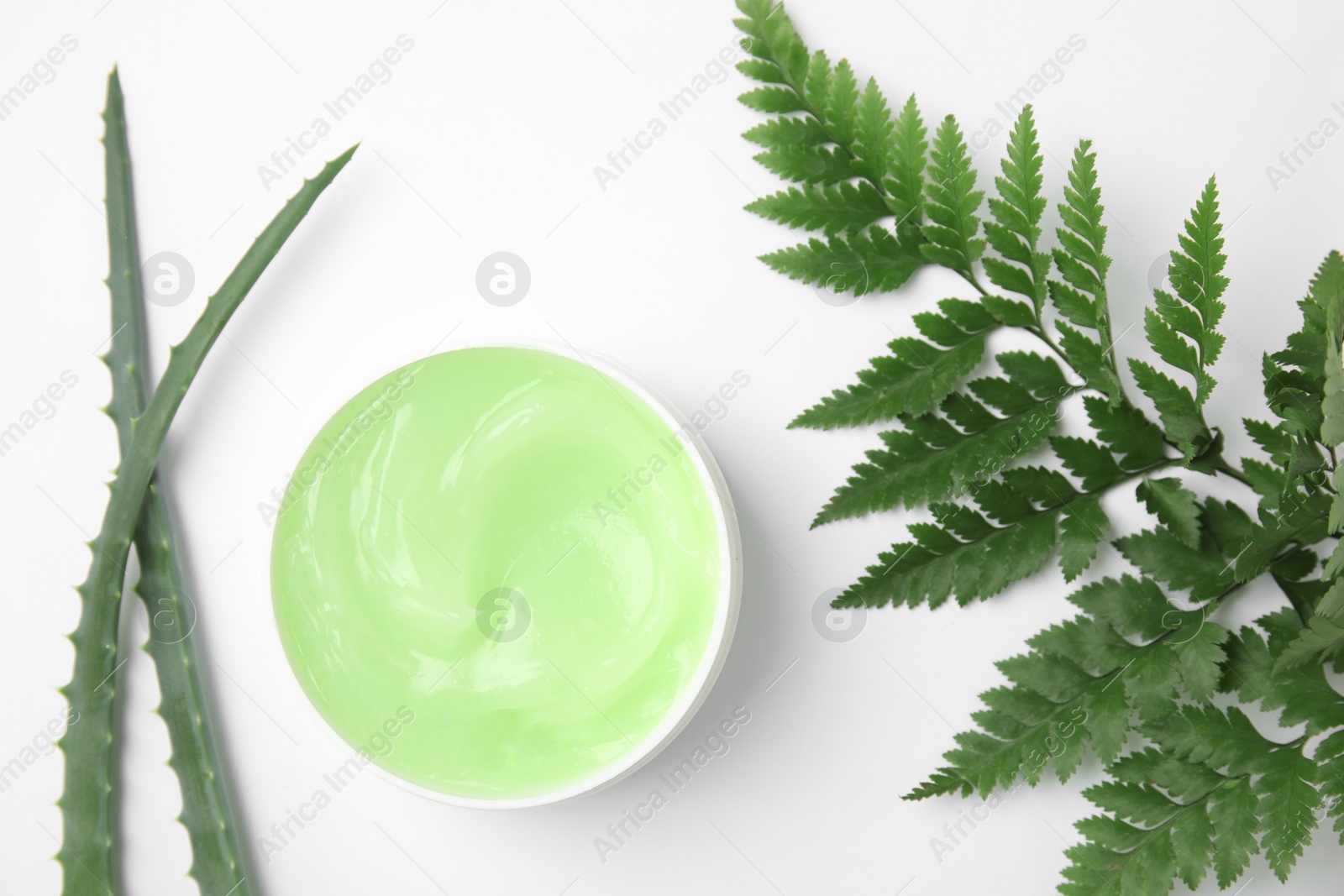 Photo of Flat lay composition with jar of body care product on white background