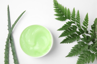 Flat lay composition with jar of body care product on white background