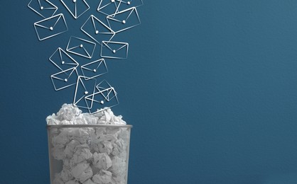 Image of Spam. Drawn envelopes falling into bin with crumpled paper on blue background, space for text