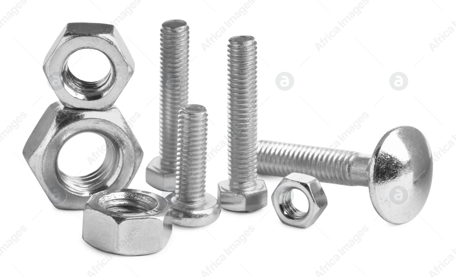 Photo of Different metal bolts and nuts on white background