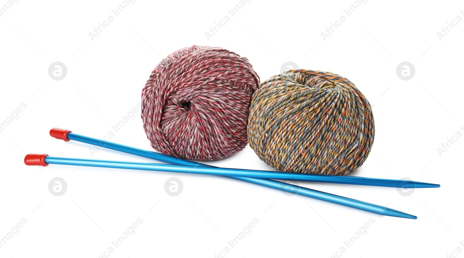 Photo of Soft woolen yarns and knitting needles on white background