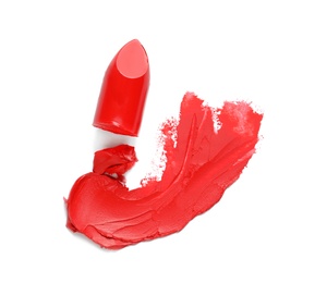 Photo of Stroke and lipstick on white background, top view