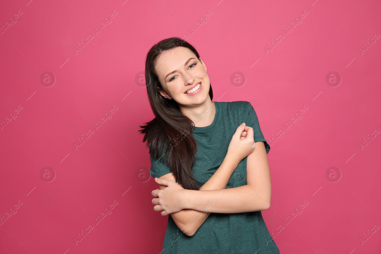 Photo of Portrait of pretty young woman on color background