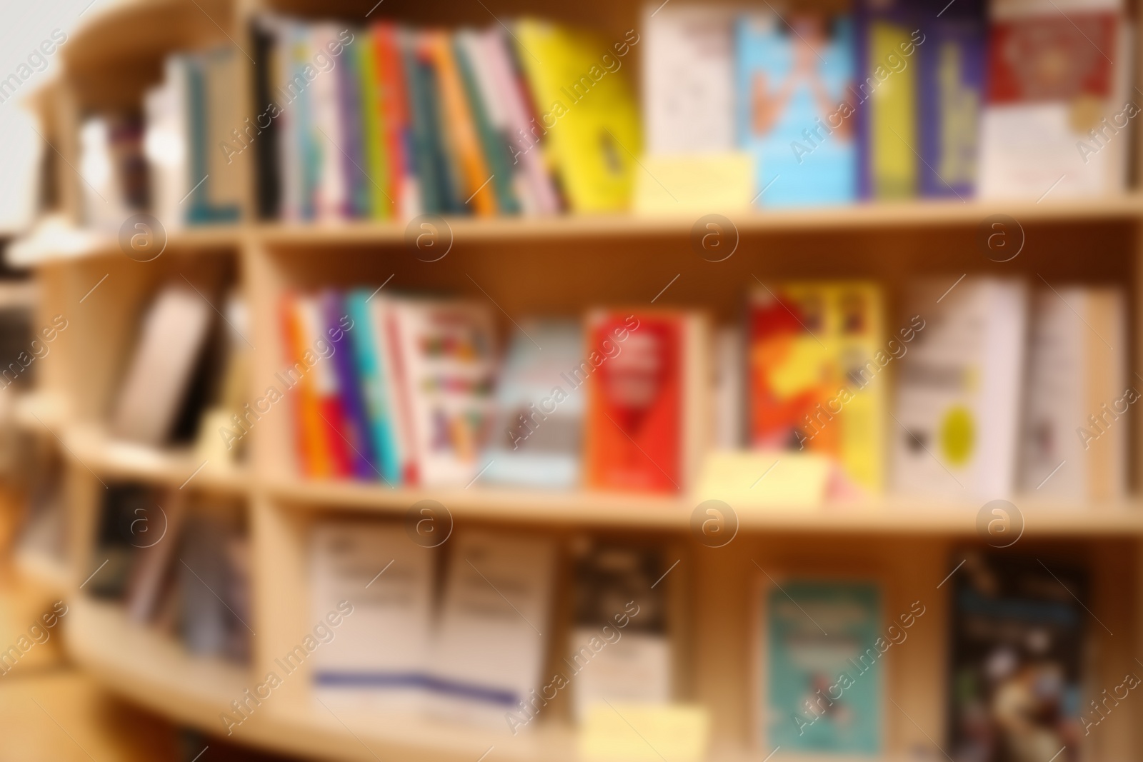 Photo of Blurred view of books on shelves in library