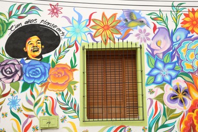 Photo of San Pedro Garza Garcia, Mexico – February 8, 2023: Building with beautiful traditional street art and window