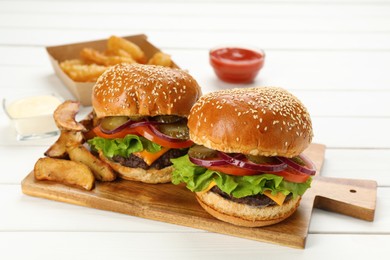 Photo of Tasty burgers served on white wooden table, closeup. Fast food
