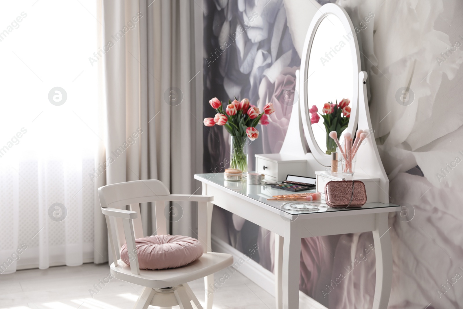 Photo of Stylish room interior with elegant dressing table and floral wallpaper