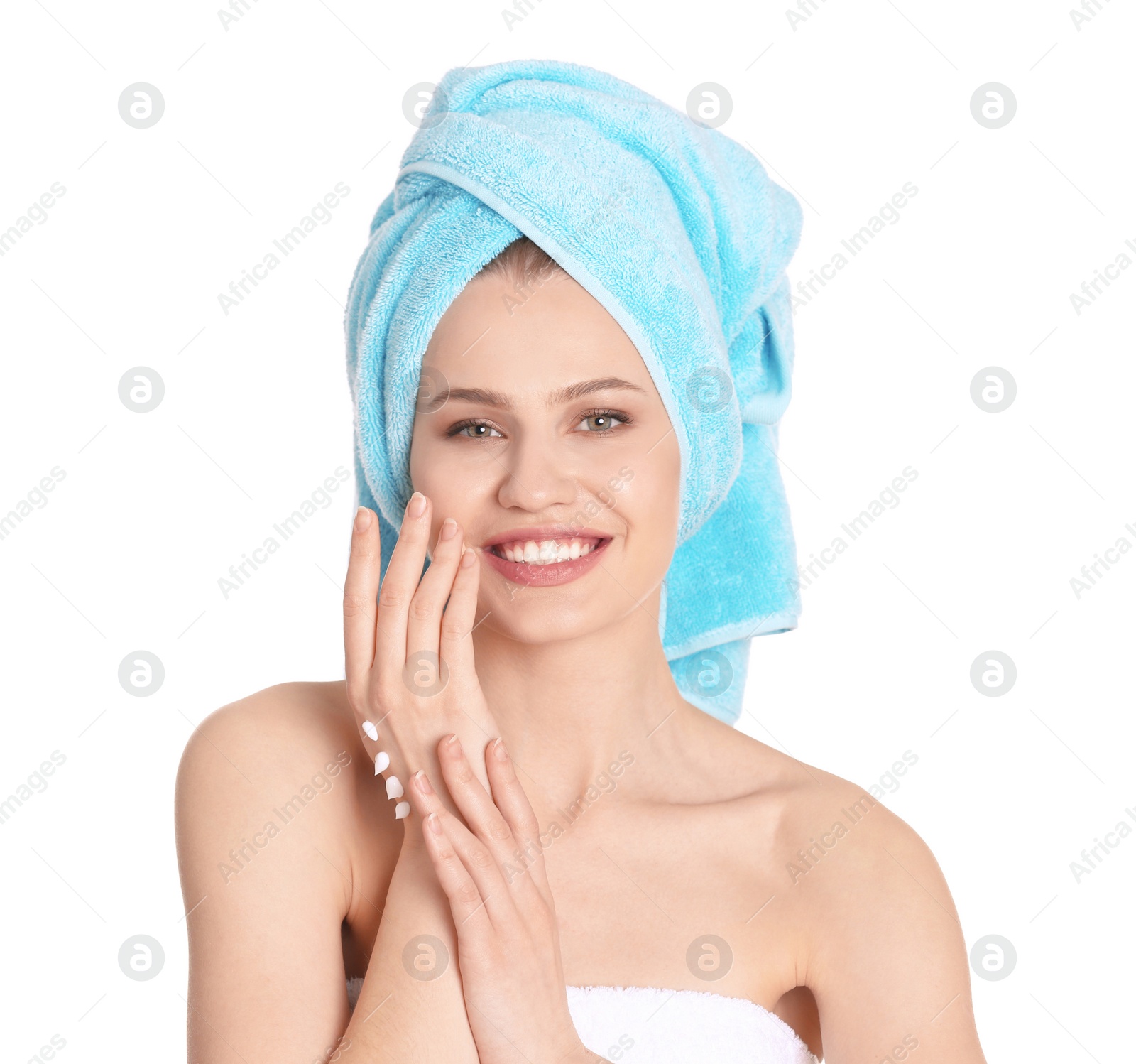 Photo of Young woman applying hand cream on white background