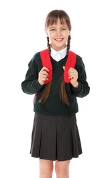 Portrait of cute girl in school uniform with backpack on white background