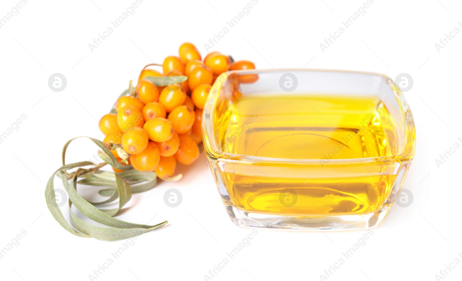 Photo of Natural sea buckthorn oil and fresh berries on white background