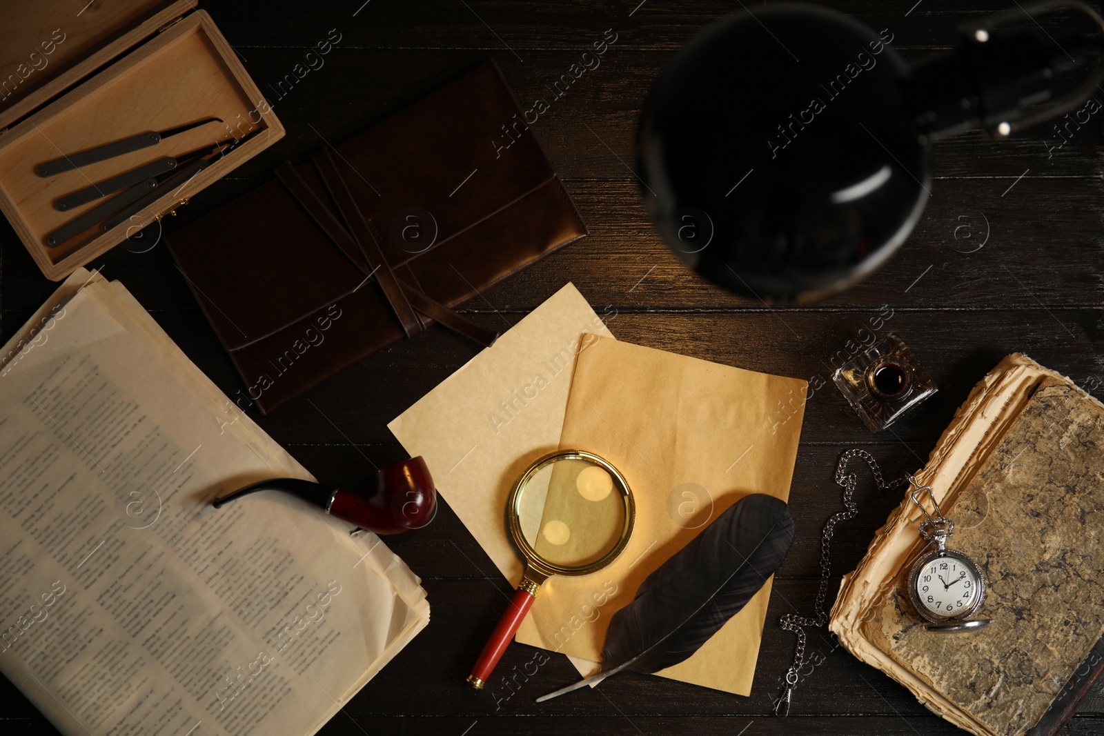 Photo of Flat lay composition with vintage detective items on dark wooden background