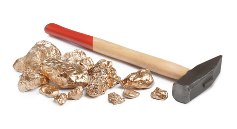 Pile of gold nuggets and hammer on white background