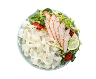 Photo of Tasty cooked rice noodles with chicken and vegetables isolated on white, top view