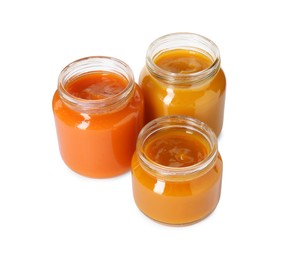 Photo of Baby food. Different healthy puree in jars isolated on white
