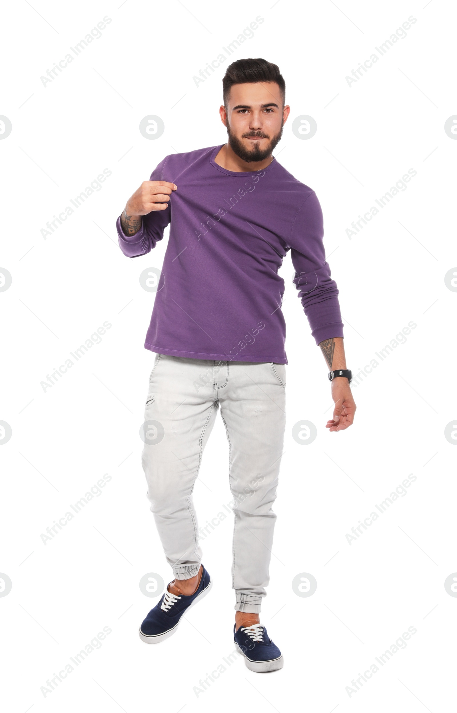 Photo of Handsome young man posing on white background