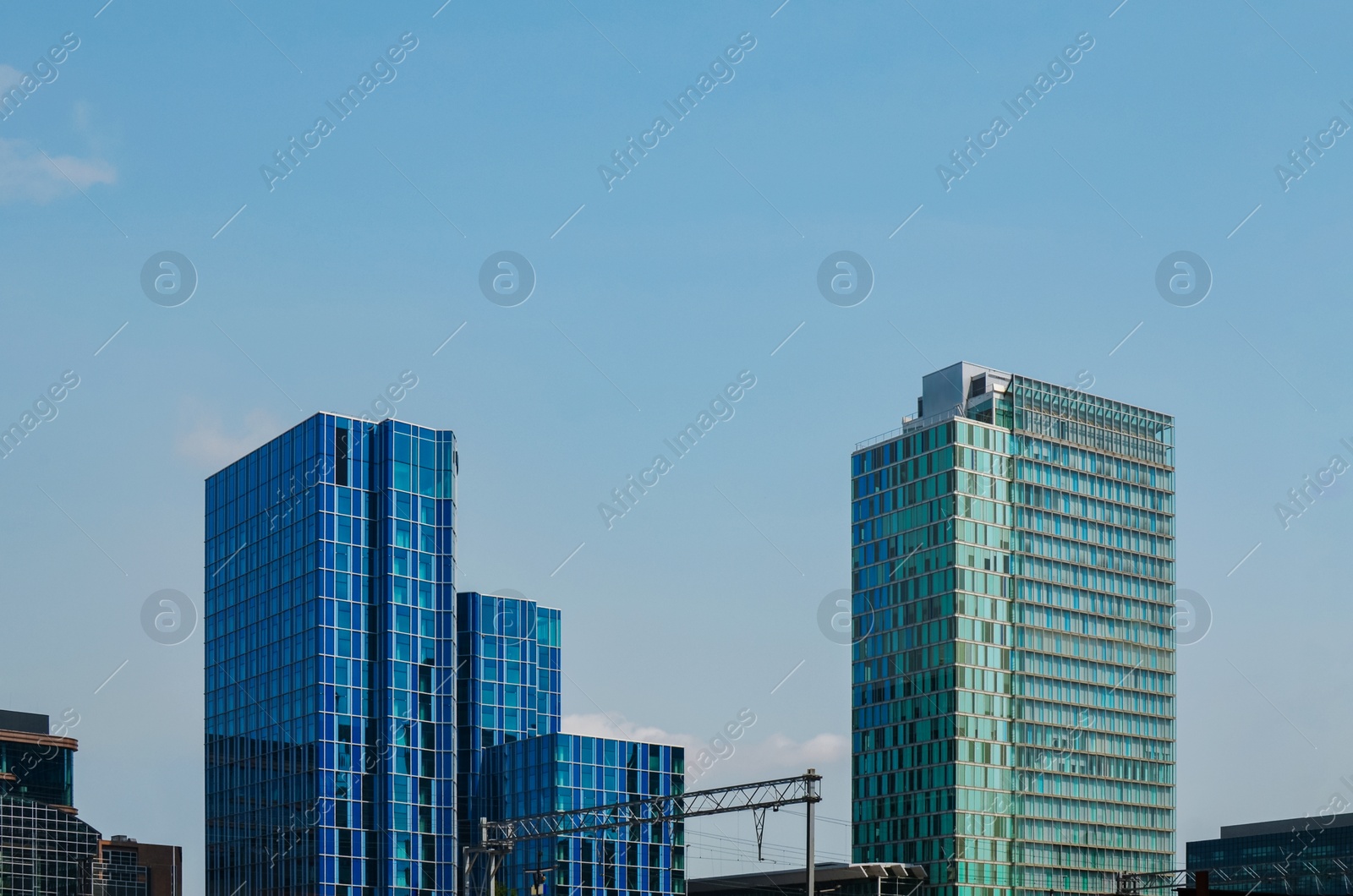 Photo of Exterior of beautiful modern skyscrapers against blue sky