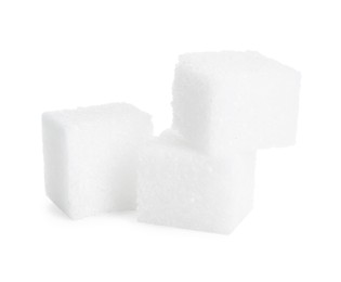 Three refined sugar cubes isolated on white