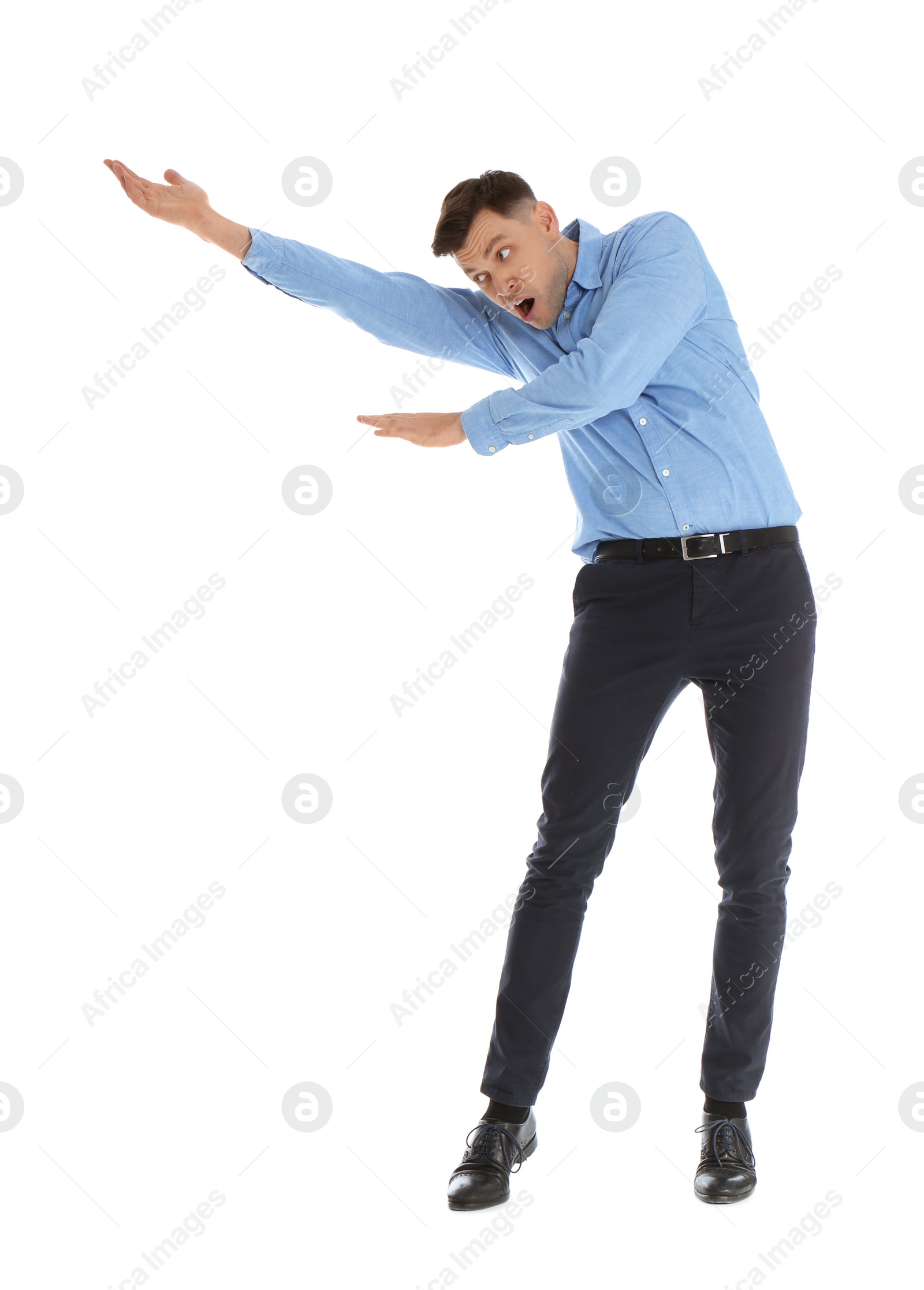 Photo of Emotional man in office wear posing on white background