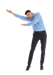 Emotional man in office wear posing on white background