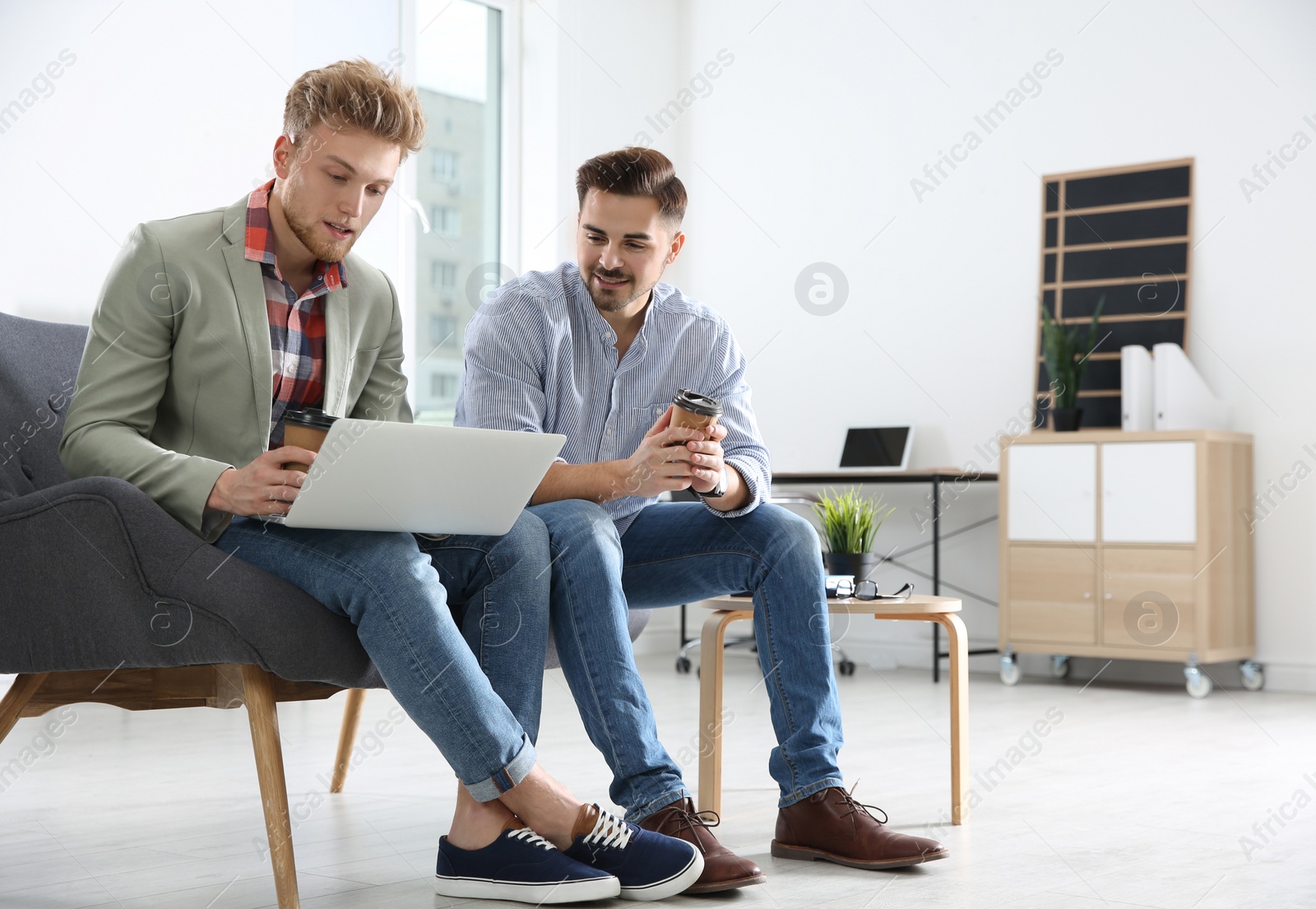 Photo of Business people working on laptop in office, space for text. Professional communication