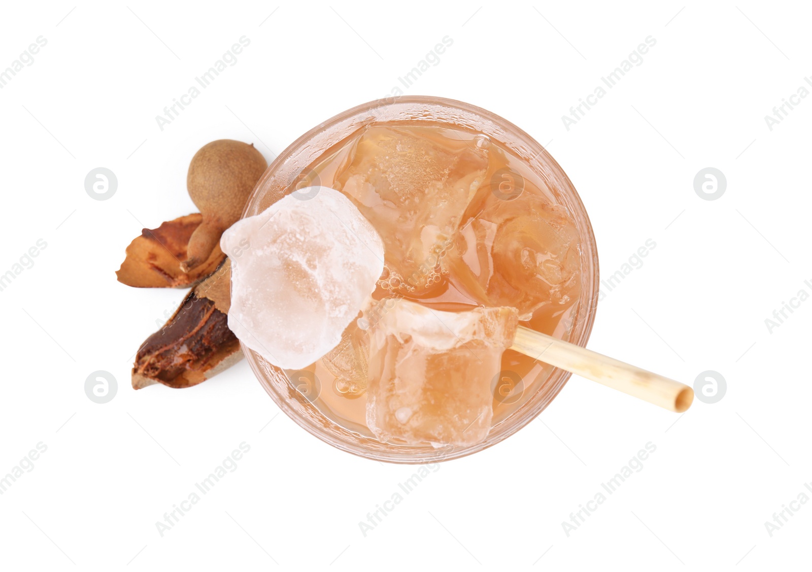 Photo of Glass of tamarind juice and fresh fruits isolated on white