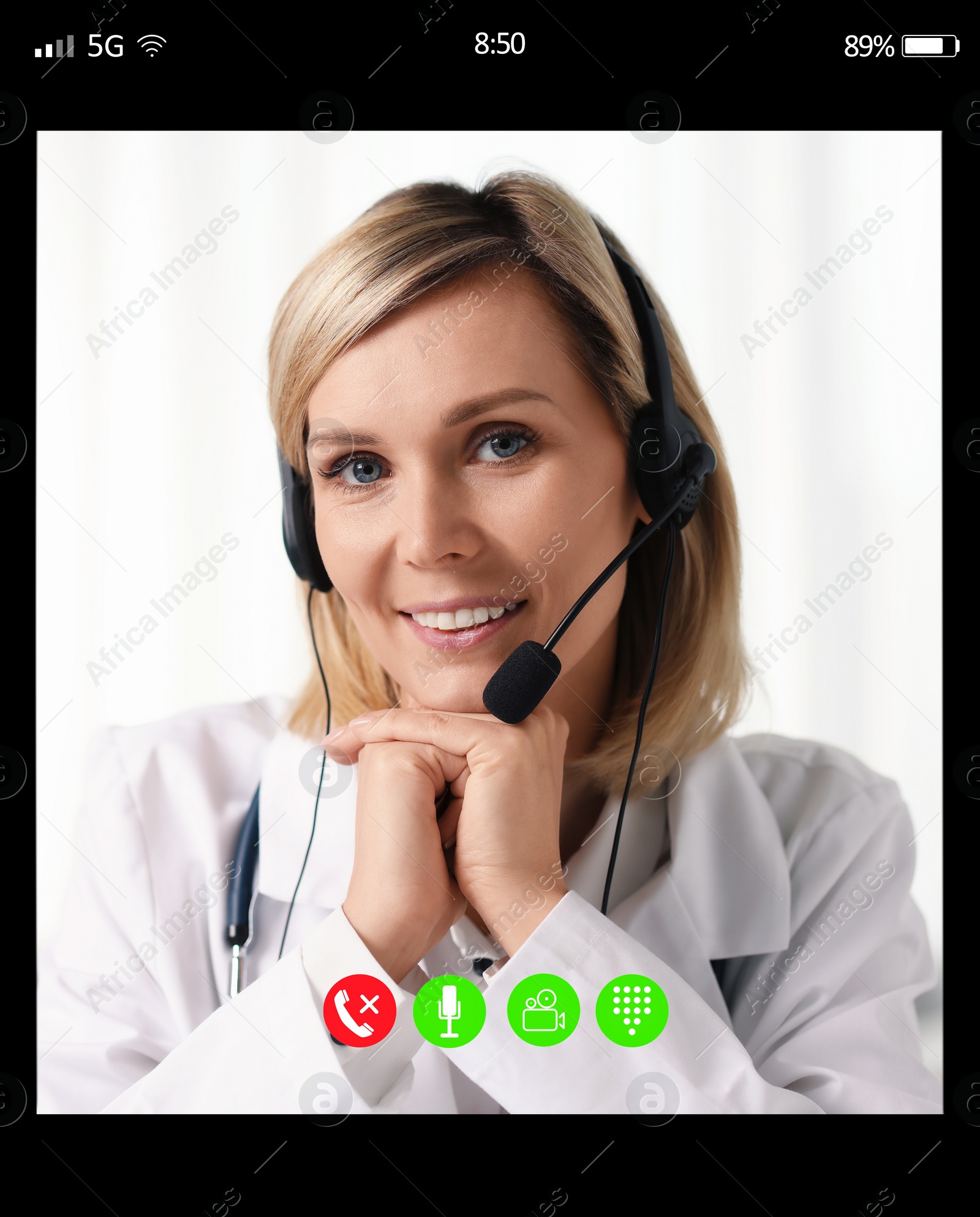 Image of Online medical consultation. Doctor with headset working via video chat application