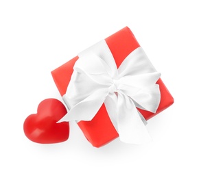 Photo of Beautiful gift box and red heart on white background, top view. Valentine's day celebration