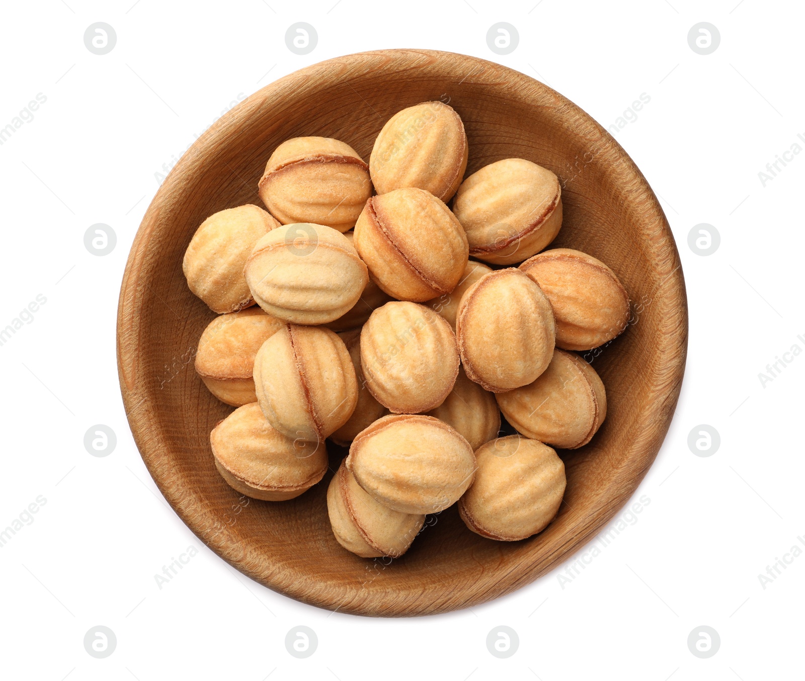 Photo of Plate of delicious nut shaped cookies with condensed milk on white background, top view