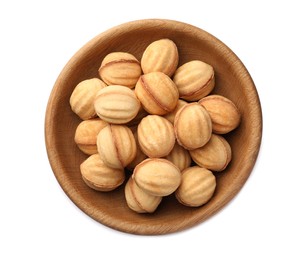 Photo of Plate of delicious nut shaped cookies with condensed milk on white background, top view