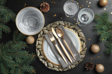 Photo of Elegant table setting on dark background, top view. Christmas celebration