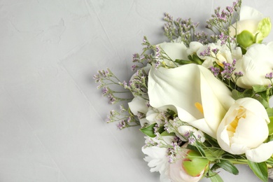 Photo of Bouquet of beautiful fragrant flowers on table