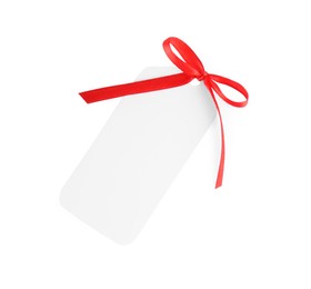 Blank gift tag with red satin ribbon on white background, top view