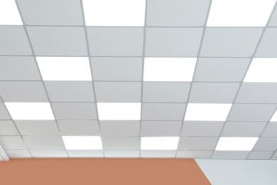 Photo of White ceiling in office room. Interior design