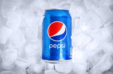 MYKOLAIV, UKRAINE - FEBRUARY 11, 2021: Can of Pepsi on ice cubes, top view